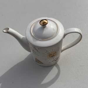 White and Gold Ceramic Teapot with Sun Motif